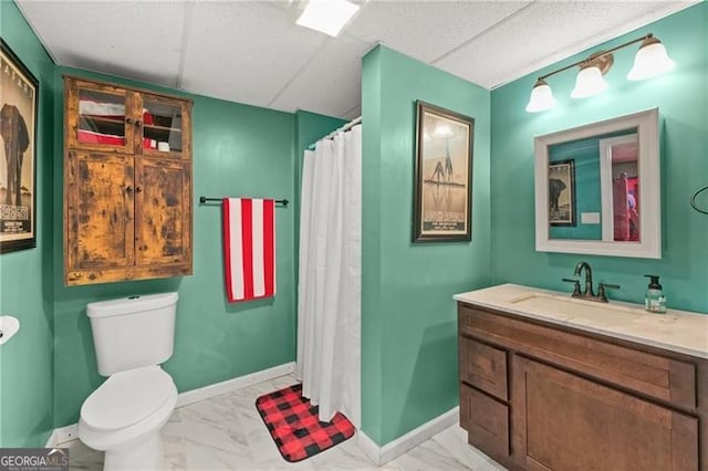 281 Wildwood Ct, Dawsonville, GA 30534 - full bathroom featuring toilet, marble look tile flooring, vanity, baseboards, and a shower with curtain