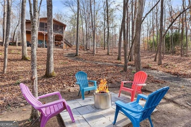 281 Wildwood Ct, Dawsonville, GA 30534 - view of patio with an outdoor fire pit