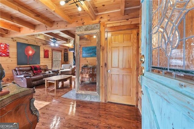 281 Wildwood Ct, Dawsonville, GA 30534 - foyer entrance with wood walls, wood finished floors, wooden ceiling with exposed beams, and a ceiling fan