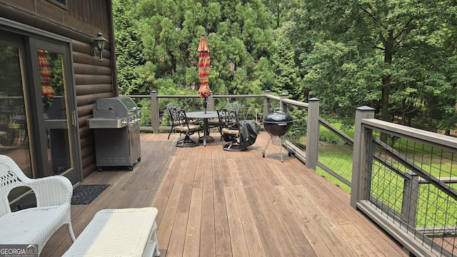 396 Greenleaf Dr, Lavonia, GA 30553 - wooden deck featuring a grill and outdoor dining area