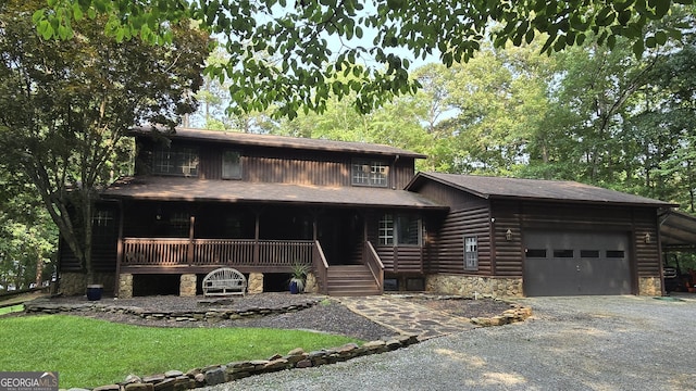 396 Greenleaf Dr, Lavonia, GA 30553 - view of front of property with a porch, stone siding, a garage, driveway, and roof with shingles
