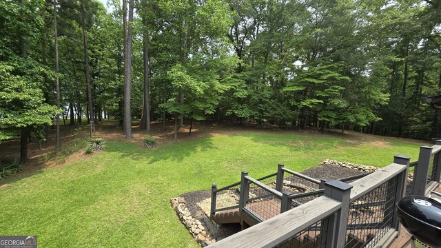 396 Greenleaf Dr, Lavonia, GA 30553 - view of green lawn with view of scattered trees and a deck