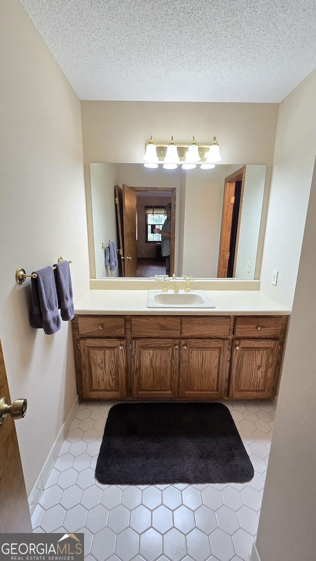 396 Greenleaf Dr, Lavonia, GA 30553 - bathroom with vanity and a textured ceiling