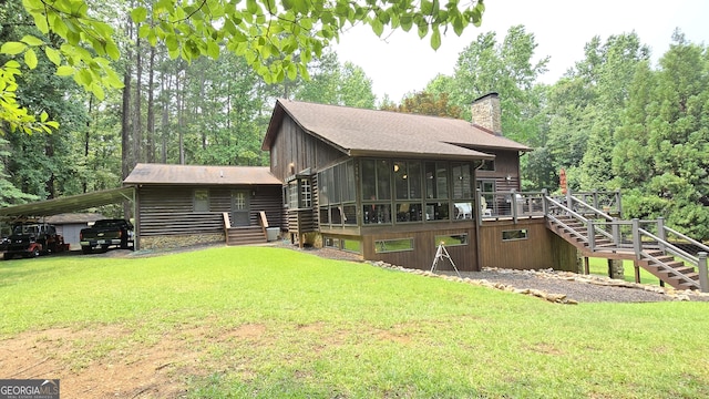 396 Greenleaf Dr, Lavonia, GA 30553 - back of property with stairs, a sunroom, a chimney, a deck, and a yard