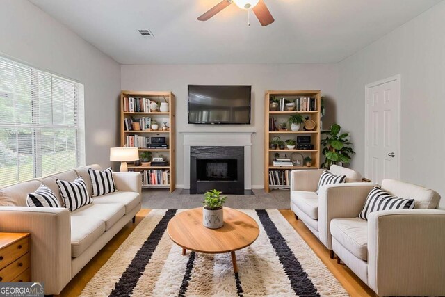 5421 Salem Springs Dr, Lithonia, GA 30038 - living room featuring a fireplace with flush hearth and a ceiling fan