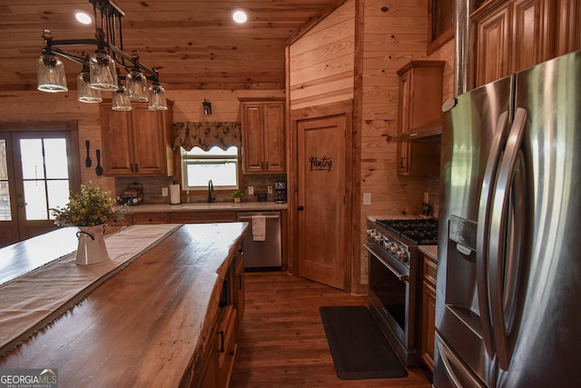 111 Possum Trot Rd, Barnesville, GA 30204 - kitchen with stainless steel appliances, butcher block counters, a sink, brown cabinetry, and dark wood-style floors
