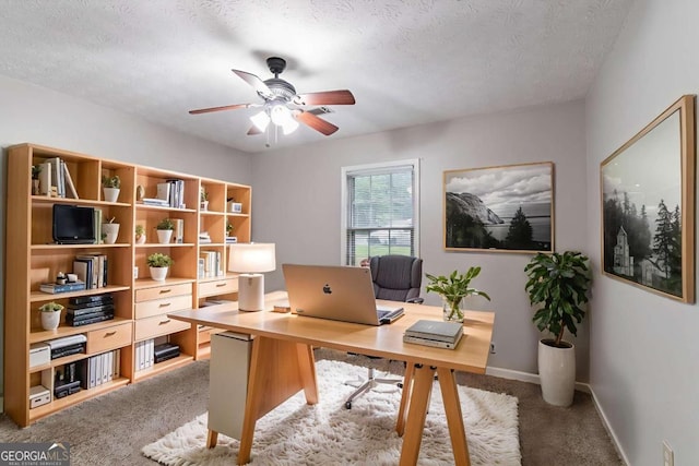 604 Hamlet Ct SE, Conyers, GA 30094 - office area featuring ceiling fan, light carpet, a textured ceiling, and baseboards