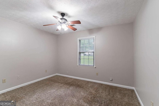604 Hamlet Ct SE, Conyers, GA 30094 - empty room featuring ceiling fan, carpet flooring, a textured ceiling, and baseboards