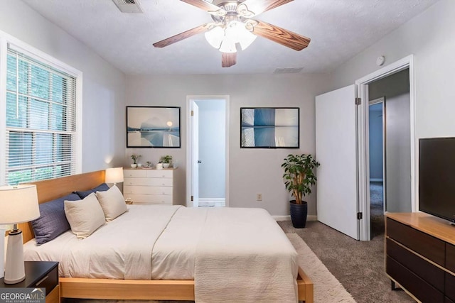 604 Hamlet Ct SE, Conyers, GA 30094 - carpeted bedroom featuring a ceiling fan and baseboards