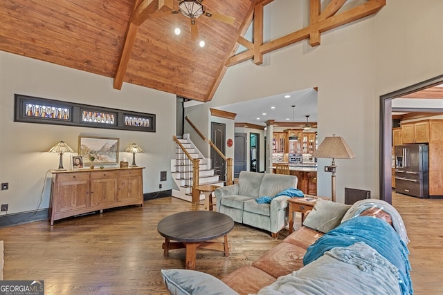 2304 Weeping Oak Dr, Braselton, GA 30517 - living room featuring stairs, high vaulted ceiling, ceiling fan, wood finished floors, and wooden ceiling with exposed beams