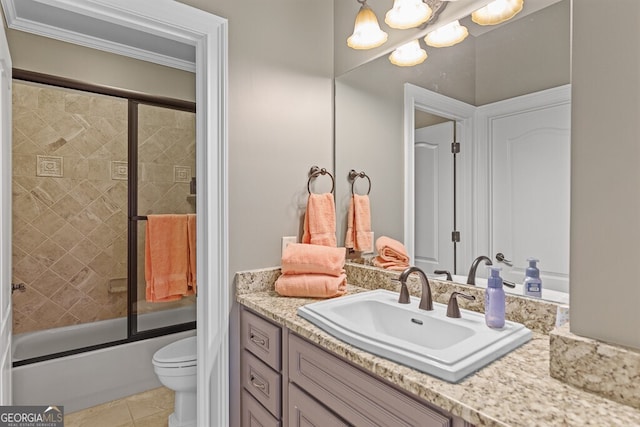 2304 Weeping Oak Dr, Braselton, GA 30517 - bathroom featuring vanity, toilet, a chandelier, bath / shower combo with glass door, and tile patterned floors