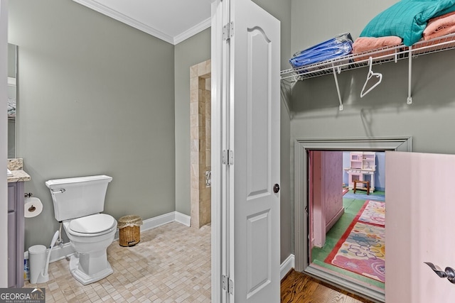 2304 Weeping Oak Dr, Braselton, GA 30517 - bathroom with toilet, ornamental molding, vanity, and baseboards