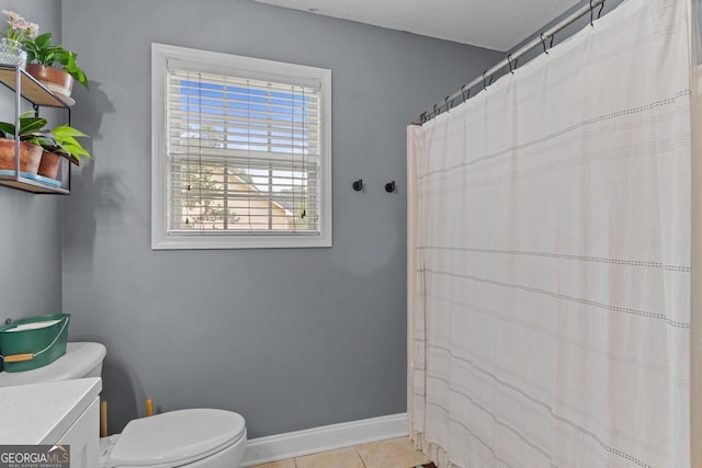 344 Mckibben Dr, Locust Grove, GA 30248 - bathroom featuring toilet, vanity, tile patterned flooring, baseboards, and a shower with shower curtain