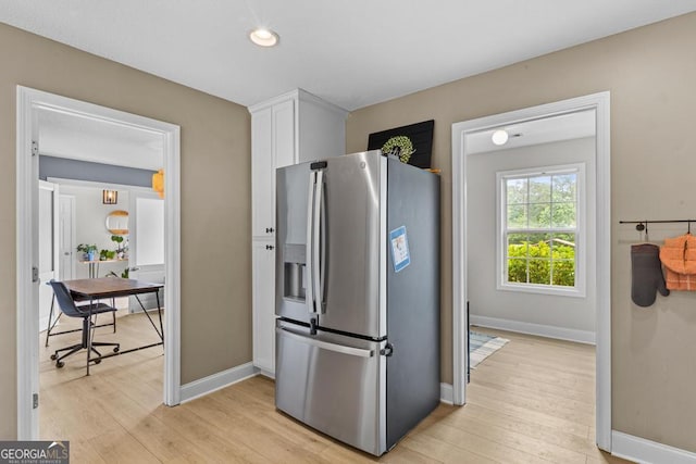 344 Mckibben Dr, Locust Grove, GA 30248 - kitchen featuring stainless steel fridge, white cabinets, light wood-style flooring, baseboards, and recessed lighting