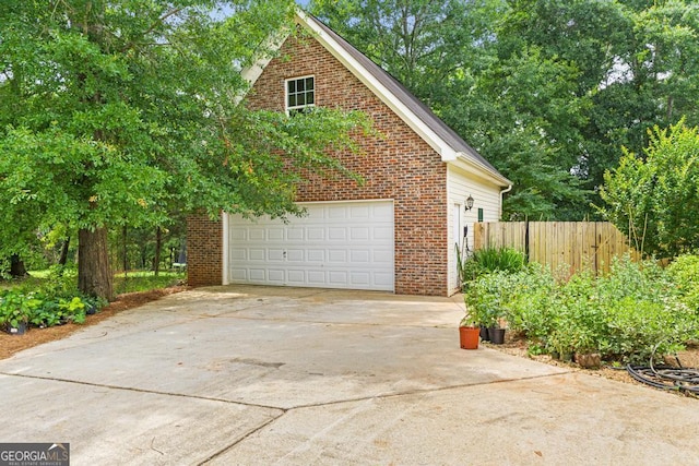 344 Mckibben Dr, Locust Grove, GA 30248 - view of home's exterior featuring brick siding, a garage, and driveway