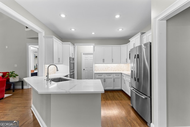 155 Carrolls Way, Fayetteville, GA 30215 - kitchen with stainless steel fridge with ice dispenser, a sink, a peninsula, white cabinetry, and recessed lighting