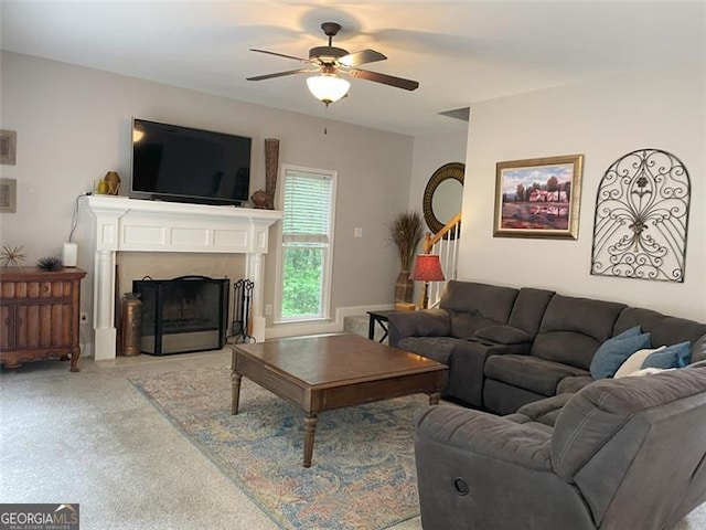 107 Sedgefield Overlook, Dallas, GA 30157 - living room with a ceiling fan, stairs, a fireplace with flush hearth, and light colored carpet