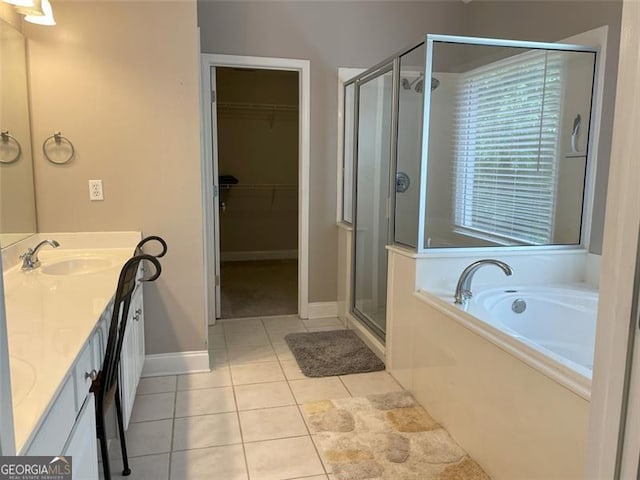 107 Sedgefield Overlook, Dallas, GA 30157 - full bath featuring a stall shower, a bath, double vanity, tile patterned flooring, and a walk in closet