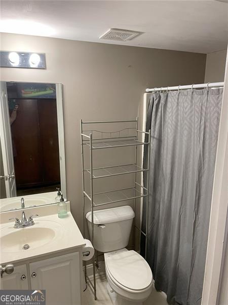 107 Sedgefield Overlook, Dallas, GA 30157 - full bath featuring vanity and a shower with shower curtain