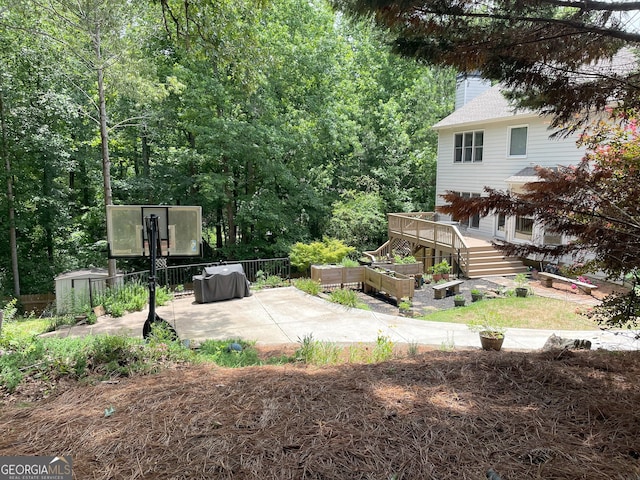 107 Sedgefield Overlook, Dallas, GA 30157 - view of yard with a patio area, a wooden deck, and a garden