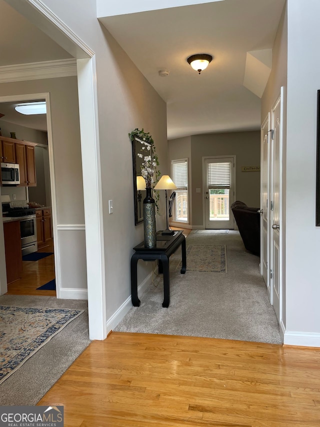 107 Sedgefield Overlook, Dallas, GA 30157 - corridor with light carpet, crown molding, and light wood-type flooring