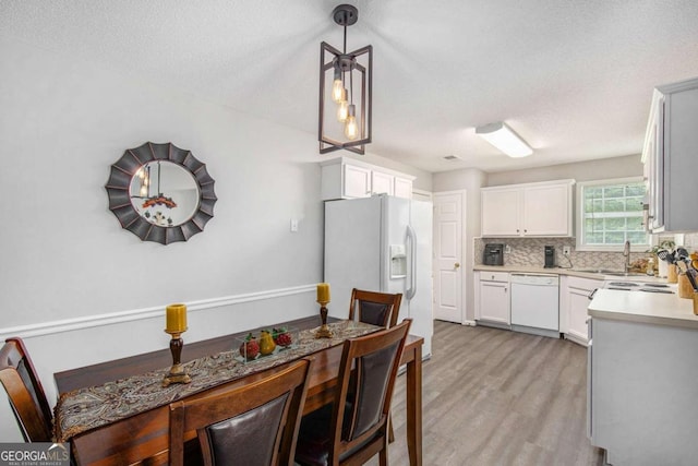169 Winding Valley Dr, Rockmart, GA 30153 - dining area featuring light wood-type flooring and a textured ceiling