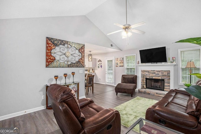 169 Winding Valley Dr, Rockmart, GA 30153 - living room featuring wood finished floors, ceiling fan, a stone fireplace, and high vaulted ceiling