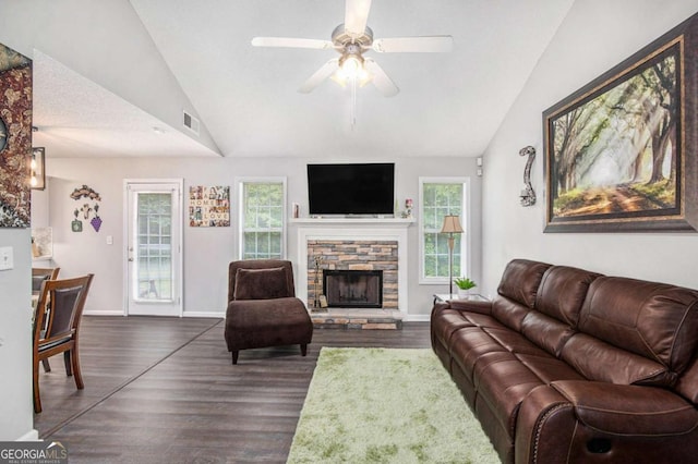 169 Winding Valley Dr, Rockmart, GA 30153 - living room with lofted ceiling, ceiling fan, dark wood-type flooring, and a stone fireplace
