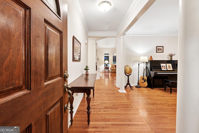 2722 Brookhaven Ln, Buford, GA 30518 - foyer entrance with crown molding, light wood-style flooring, and decorative columns