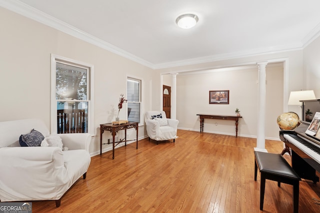 2722 Brookhaven Ln, Buford, GA 30518 - living area featuring decorative columns, ornamental molding, and light wood finished floors