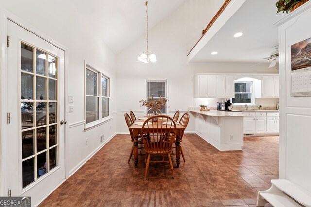 2722 Brookhaven Ln, Buford, GA 30518 - dining room featuring a chandelier, vaulted ceiling, recessed lighting, tile patterned floors, and ceiling fan