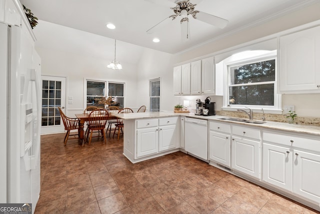 2722 Brookhaven Ln, Buford, GA 30518 - kitchen featuring white appliances, a peninsula, a chandelier, white cabinets, and recessed lighting
