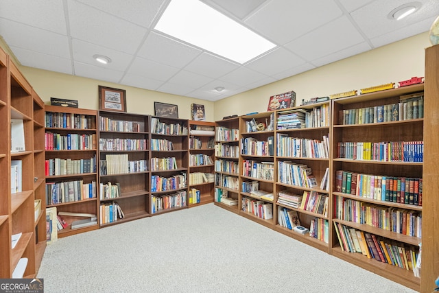 2722 Brookhaven Ln, Buford, GA 30518 - miscellaneous room with wall of books, a drop ceiling, and carpet floors