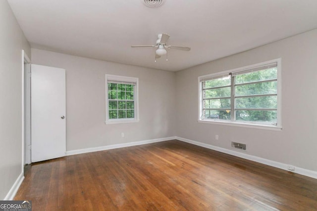 2582 Springdale Rd SW, Atlanta, GA 30315 - empty room featuring hardwood / wood-style floors, healthy amount of natural light, baseboards, and ceiling fan