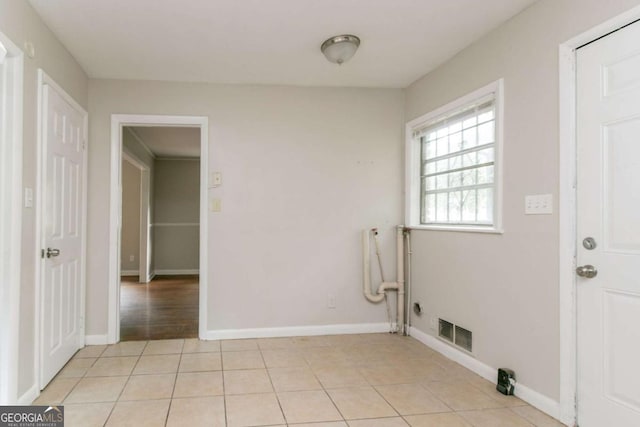 2582 Springdale Rd SW, Atlanta, GA 30315 - laundry area featuring light tile patterned floors and baseboards