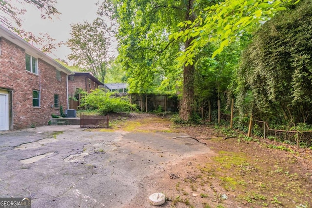 2582 Springdale Rd SW, Atlanta, GA 30315 - view of yard featuring central air condition unit and a patio area