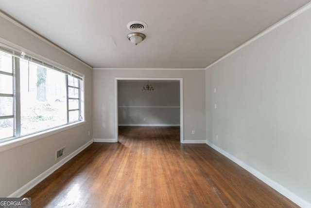 2582 Springdale Rd SW, Atlanta, GA 30315 - unfurnished room featuring wood finished floors, ornamental molding, and baseboards