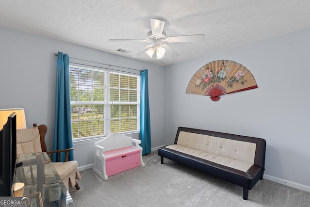 320 Cobb Ct, Hampton, GA 30228 - sitting room with carpet floors, a ceiling fan, baseboards, and a textured ceiling