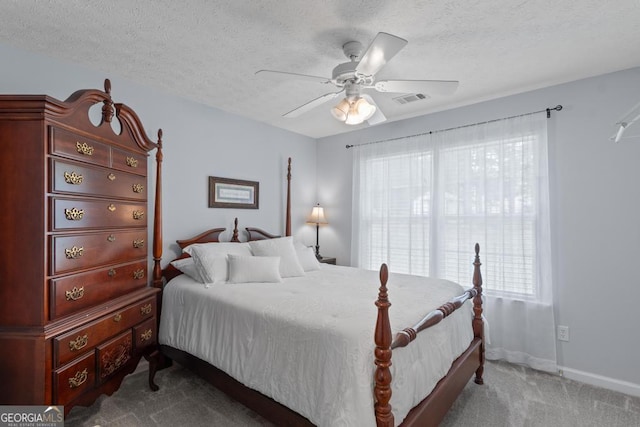 320 Cobb Ct, Hampton, GA 30228 - carpeted bedroom with a textured ceiling, baseboards, and a ceiling fan