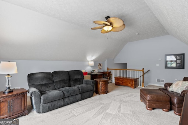 320 Cobb Ct, Hampton, GA 30228 - carpeted living room with lofted ceiling, ceiling fan, and a textured ceiling