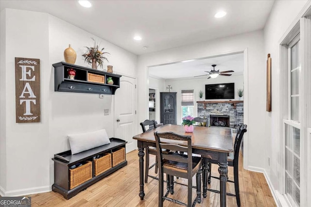 1637 Willow Way, Woodstock, GA 30188 - dining space with a fireplace, a ceiling fan, light wood-style floors, baseboards, and recessed lighting