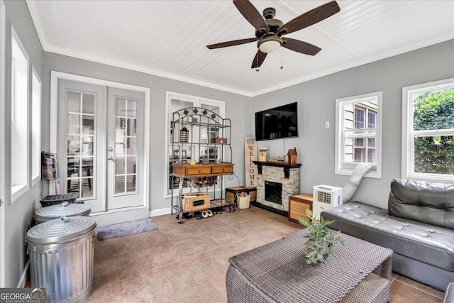 1637 Willow Way, Woodstock, GA 30188 - tiled living room with a stone fireplace, ceiling fan, and ornamental molding