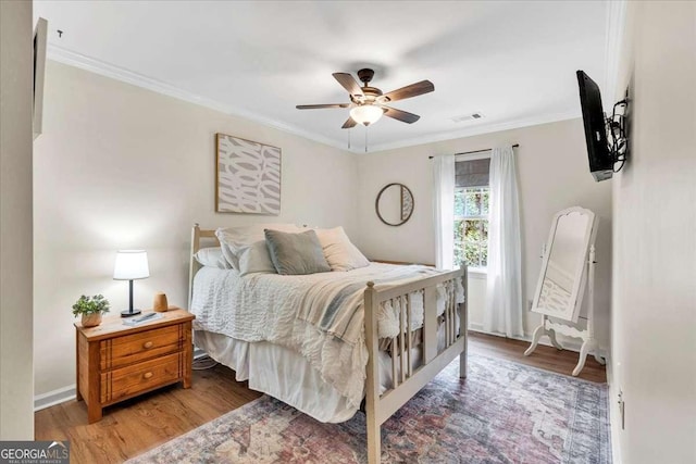 1637 Willow Way, Woodstock, GA 30188 - bedroom featuring wood finished floors, crown molding, a ceiling fan, and baseboards