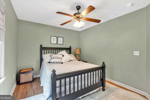 1637 Willow Way, Woodstock, GA 30188 - bedroom with wood finished floors, baseboards, and a ceiling fan