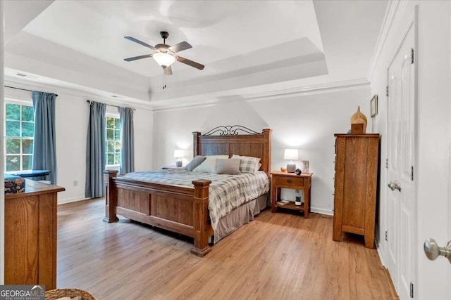 1637 Willow Way, Woodstock, GA 30188 - bedroom featuring a tray ceiling, light wood finished floors, baseboards, and ceiling fan
