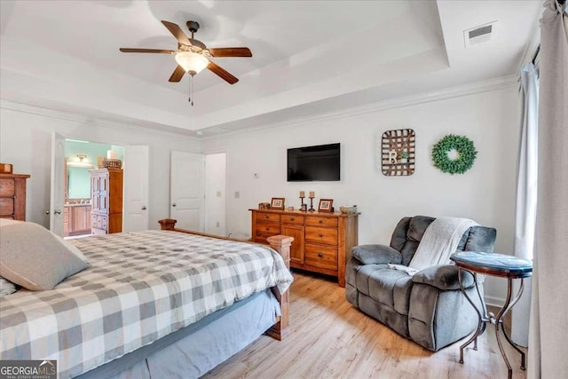 1637 Willow Way, Woodstock, GA 30188 - bedroom featuring a raised ceiling, light wood finished floors, a ceiling fan, and ensuite bathroom