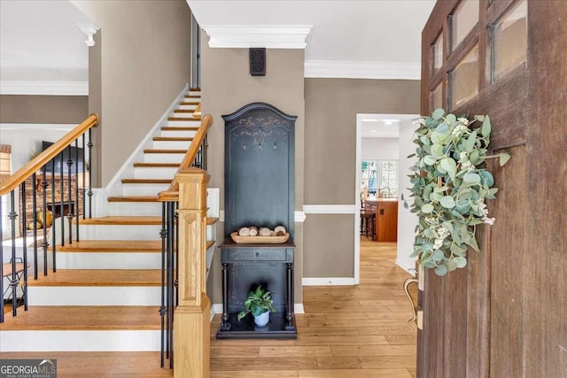 1637 Willow Way, Woodstock, GA 30188 - stairs featuring crown molding, hardwood / wood-style flooring, and baseboards