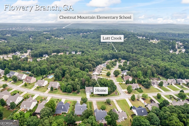 5511 Preserve Pt, Flowery Branch, GA 30542 - aerial view of residential area featuring a heavily wooded area