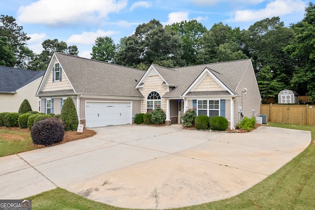 5511 Preserve Pt, Flowery Branch, GA 30542 - view of front of home with driveway, a garage, roof with shingles, and stone siding