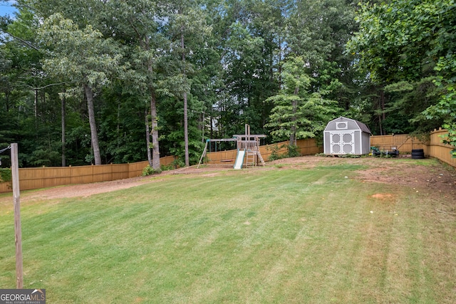 5511 Preserve Pt, Flowery Branch, GA 30542 - fenced backyard featuring a playground and a shed